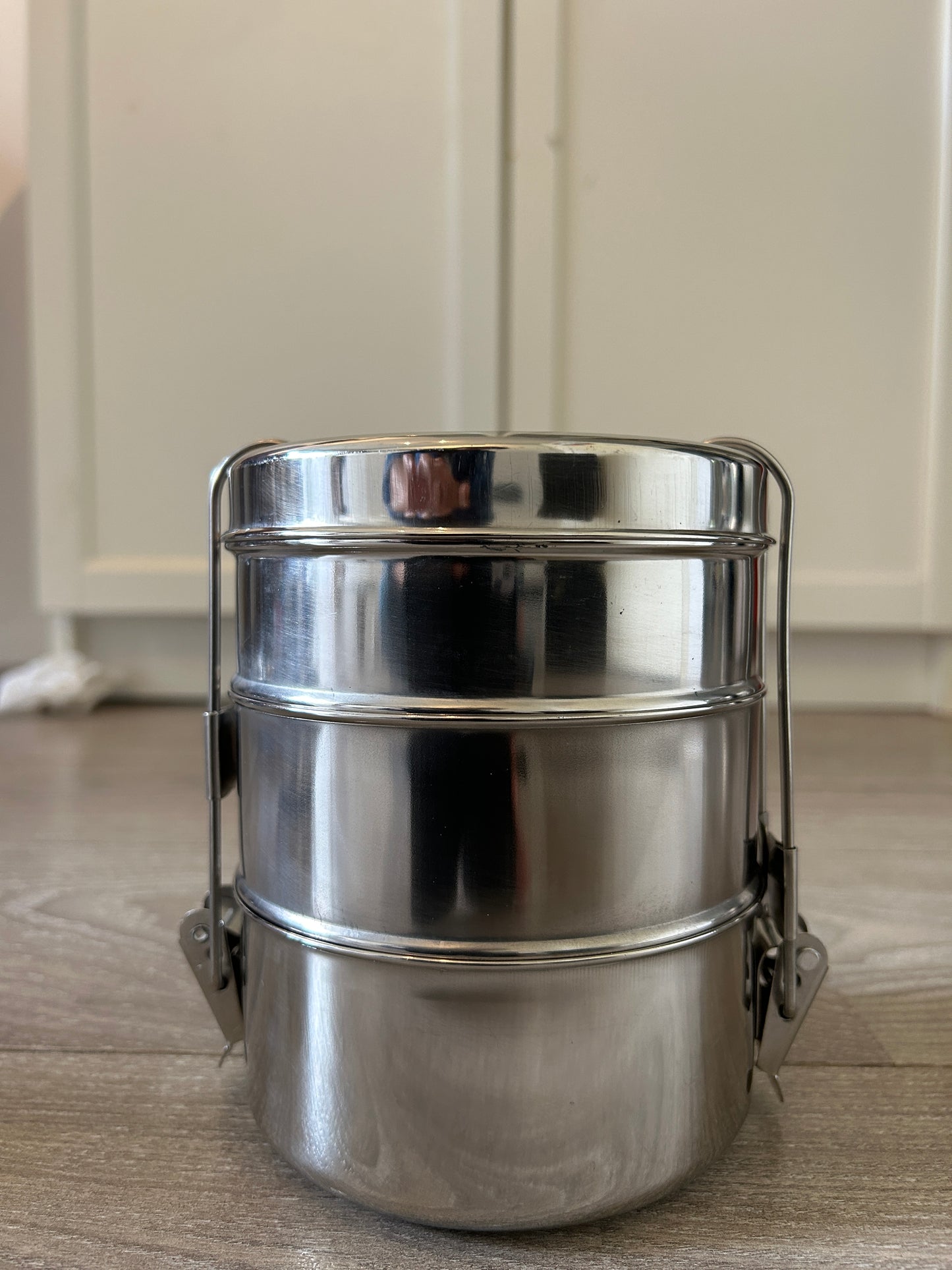 Metallic container on a wooden surface